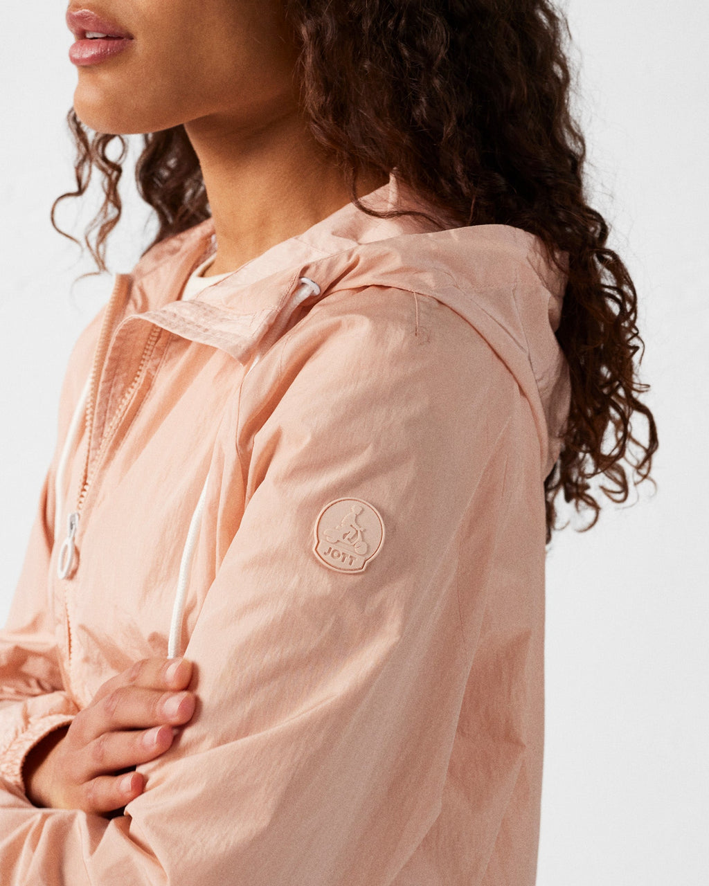 Blouson coupe-vent léger à capuche Pêche clair Alize